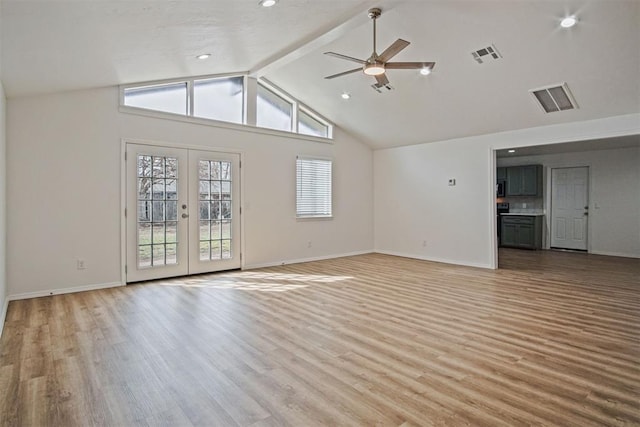 unfurnished living room with lofted ceiling with beams, french doors, light wood-type flooring, and visible vents