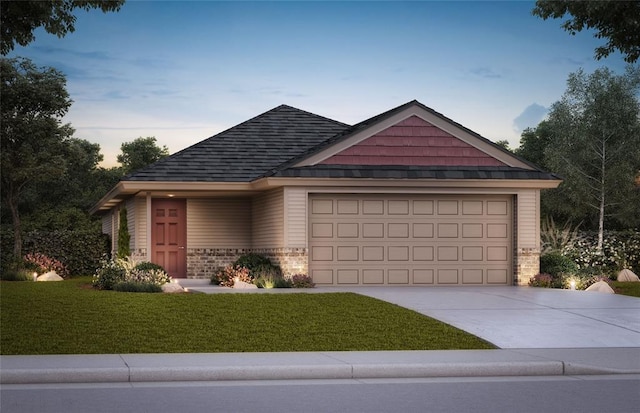 view of front facade with a shingled roof, concrete driveway, an attached garage, a front yard, and brick siding