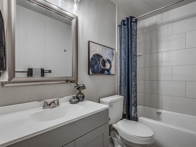 bathroom with a textured wall, shower / bath combination with curtain, vanity, and toilet