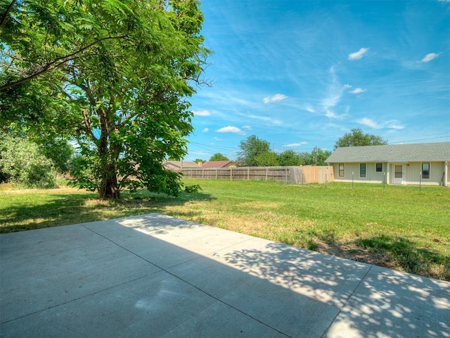 view of patio / terrace featuring fence