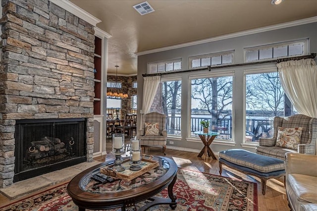 interior space featuring ornamental molding, a wealth of natural light, and visible vents