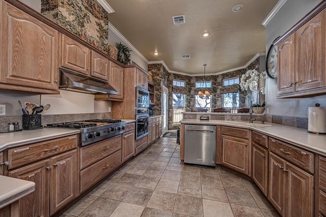 kitchen featuring stainless steel appliances, visible vents, ornamental molding, a sink, and under cabinet range hood