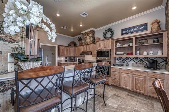 kitchen featuring visible vents, appliances with stainless steel finishes, crown molding, under cabinet range hood, and open shelves