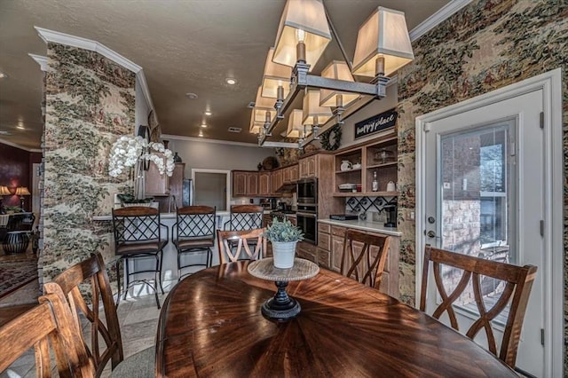 dining room with recessed lighting, crown molding, and a textured ceiling