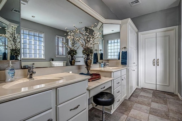 full bathroom with vanity and visible vents