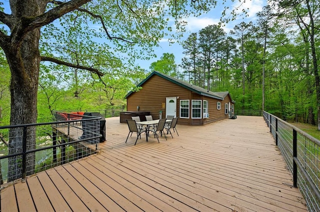 387 N Riverbend Rd, Smithville, OK 74957 - wooden terrace with outdoor dining area
