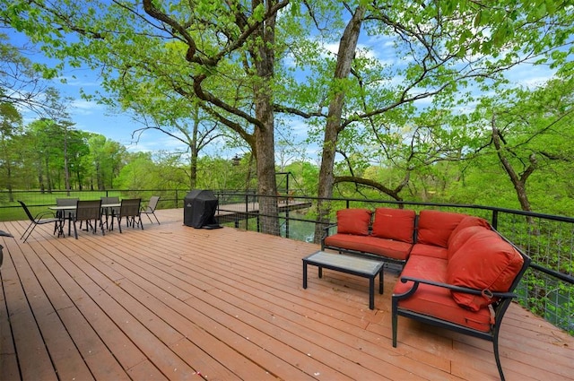 387 N Riverbend Rd, Smithville, OK 74957 - wooden deck featuring grilling area and an outdoor hangout area