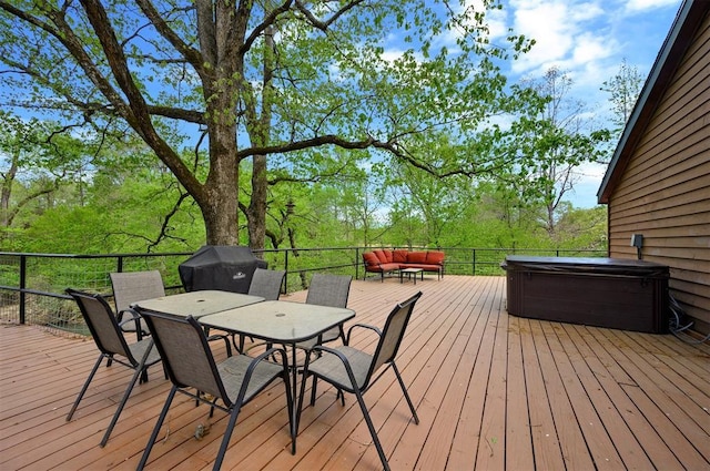 387 N Riverbend Rd, Smithville, OK 74957 - wooden terrace featuring area for grilling, an outdoor hangout area, a hot tub, and outdoor dining space