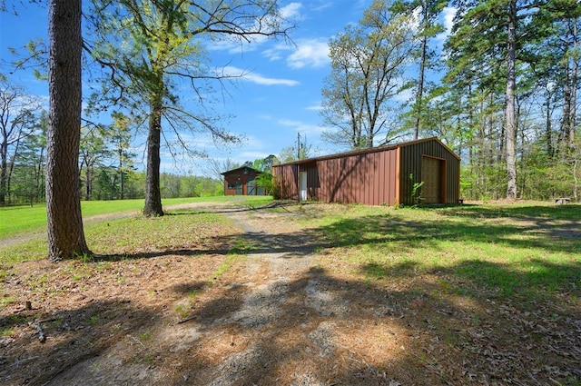 387 N Riverbend Rd, Smithville, OK 74957 - view of yard with an outbuilding