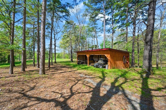 387 N Riverbend Rd, Smithville, OK 74957 - exterior space with a carport