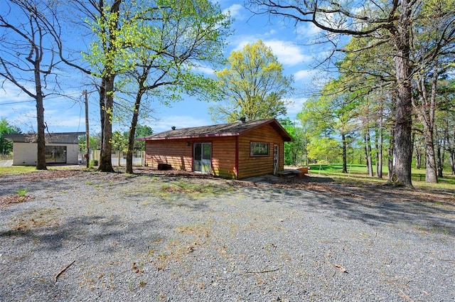 387 N Riverbend Rd, Smithville, OK 74957 - view of side of home featuring an outdoor structure