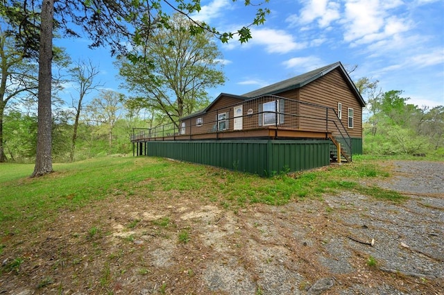 387 N Riverbend Rd, Smithville, OK 74957 - view of home's exterior featuring stairway and a wooden deck