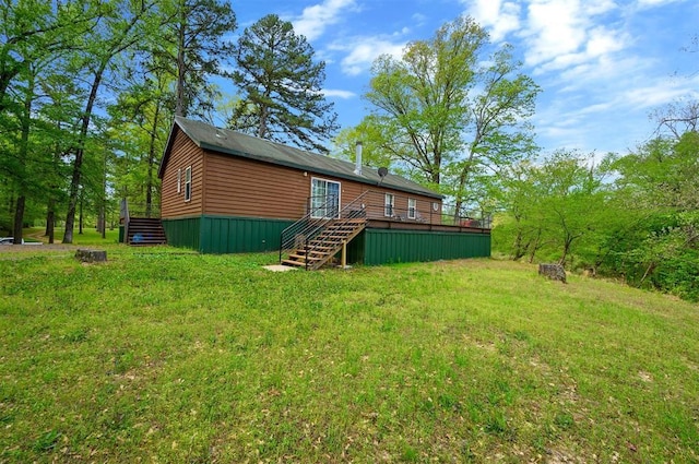387 N Riverbend Rd, Smithville, OK 74957 - rear view of property featuring a lawn, a wooden deck, and stairs