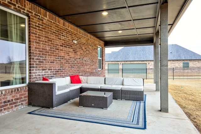 view of patio / terrace with outdoor lounge area and fence