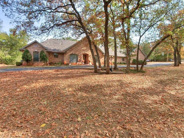 view of front of house featuring brick siding