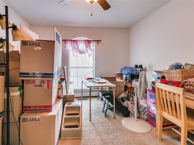 interior space featuring carpet and ceiling fan