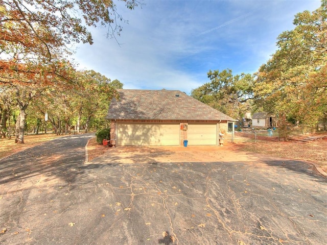 view of property exterior with a garage