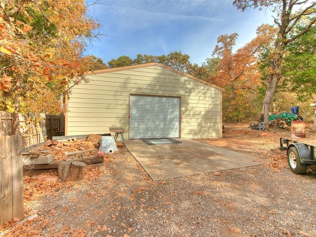 exterior space featuring driveway and fence