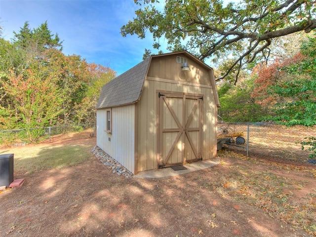 view of shed with central AC and a fenced backyard