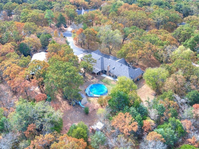 drone / aerial view featuring a forest view