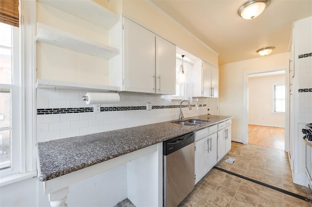 kitchen featuring a sink, white cabinetry, appliances with stainless steel finishes, open shelves, and tasteful backsplash