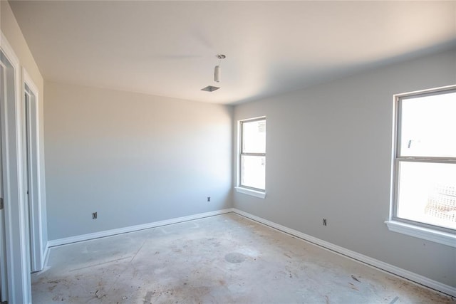 3817 Lynne Ave, Edmond, OK 73012 - unfurnished room with unfinished concrete floors and baseboards