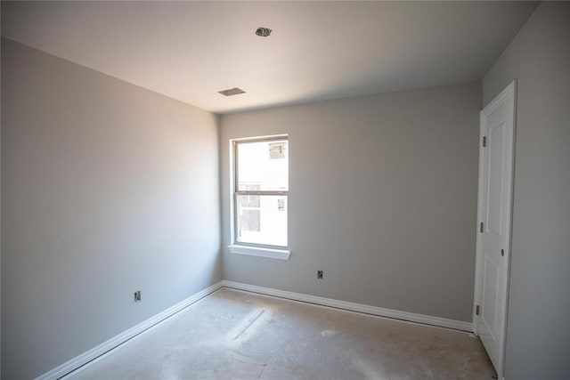 3817 Lynne Ave, Edmond, OK 73012 - empty room with concrete flooring and baseboards