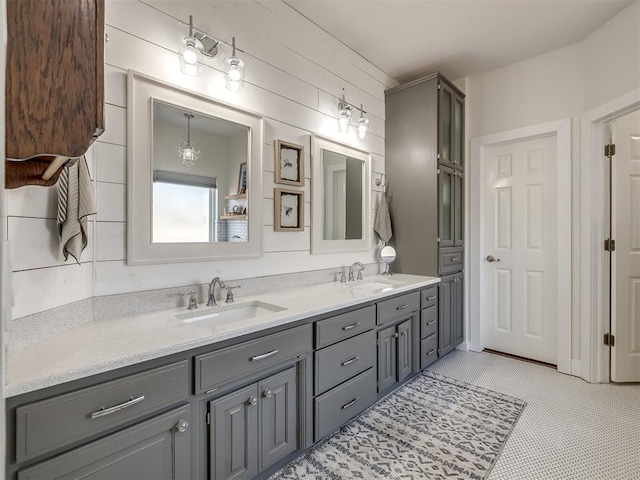 bathroom with double vanity and a sink