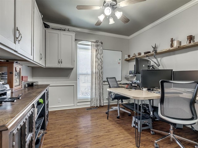 office area featuring ornamental molding, a ceiling fan, and dark wood-style floors