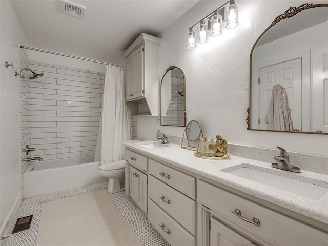 full bathroom featuring visible vents, a sink, and tile patterned floors