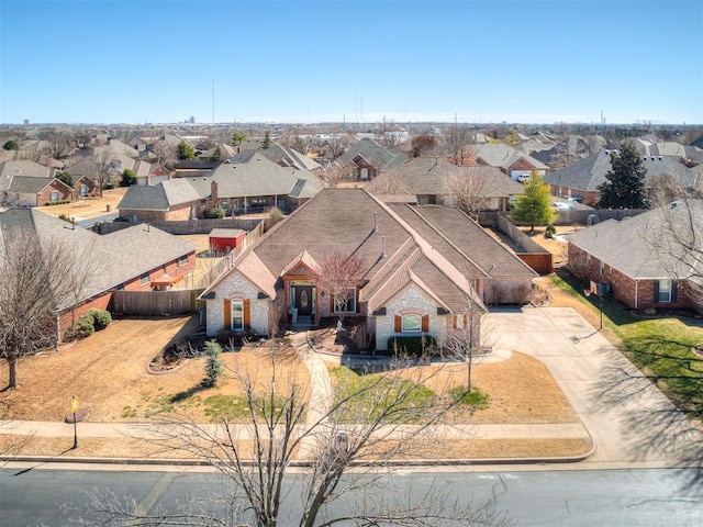 birds eye view of property with a residential view