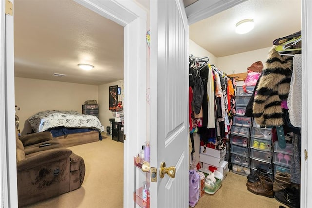 spacious closet with carpet and visible vents