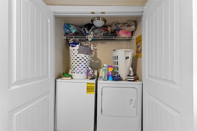 washroom featuring laundry area and washer and clothes dryer