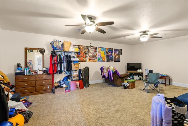 bedroom with ceiling fan, carpet, and baseboards