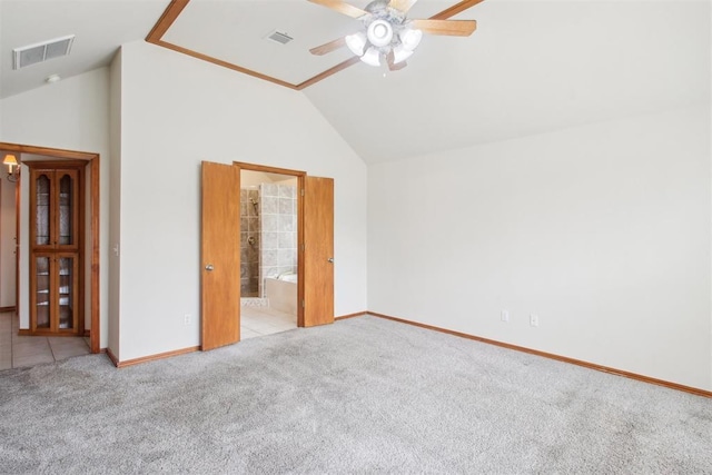 unfurnished bedroom featuring carpet floors, high vaulted ceiling, baseboards, and visible vents