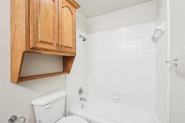 bathroom featuring washtub / shower combination and toilet