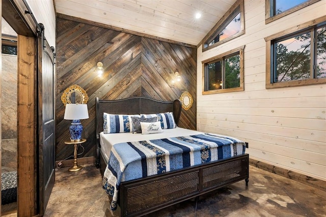 bedroom with wooden walls, concrete floors, a barn door, vaulted ceiling, and wooden ceiling