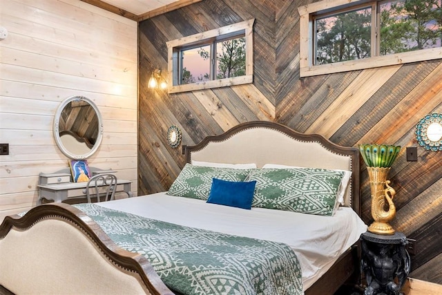 bedroom featuring wooden walls