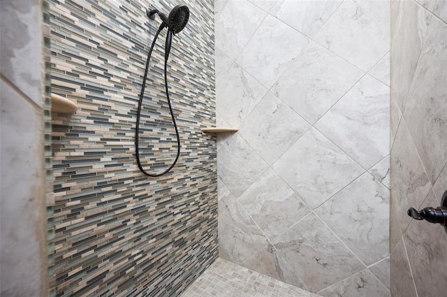 bathroom with tiled shower