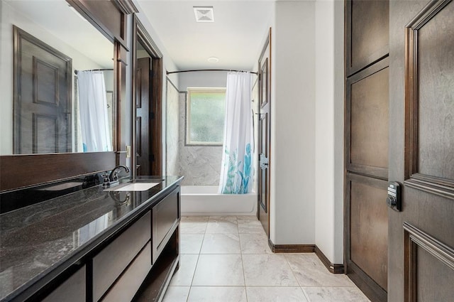 bathroom featuring visible vents, shower / bathtub combination with curtain, vanity, baseboards, and tile patterned floors