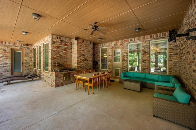 view of patio with an outdoor living space, a ceiling fan, and outdoor dining space