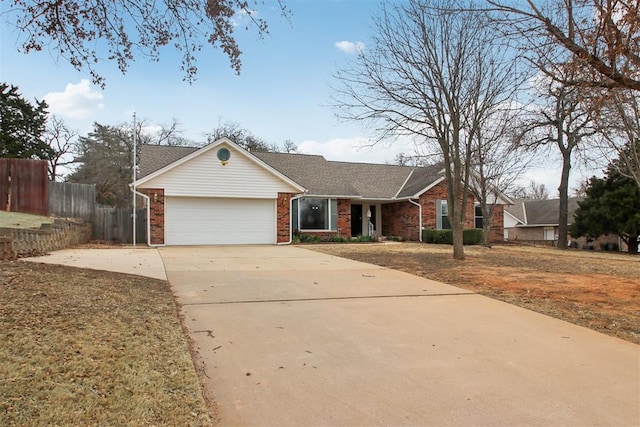 ranch-style house featuring an attached garage, driveway, fence, and brick siding