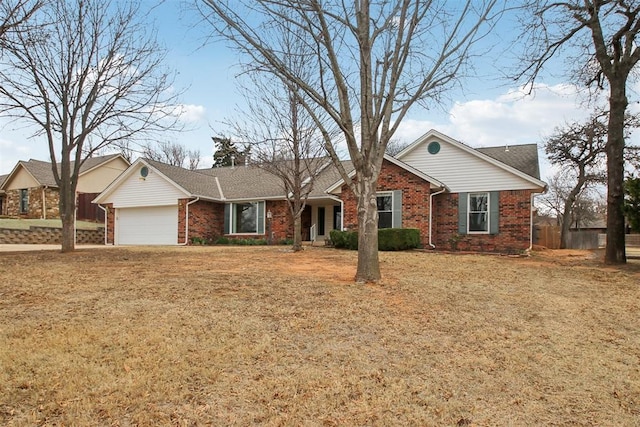 ranch-style home featuring brick siding, a front lawn, and an attached garage