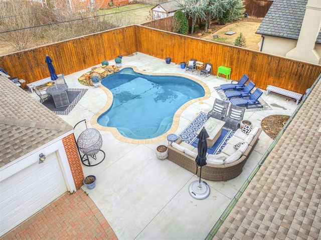 view of swimming pool with a fenced in pool, a patio, and a fenced backyard