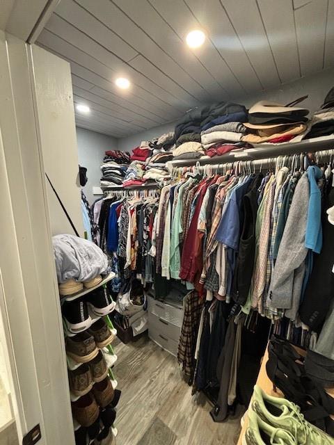 walk in closet featuring wood finished floors