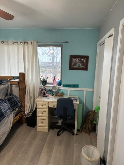 bedroom with light wood-style flooring and ceiling fan