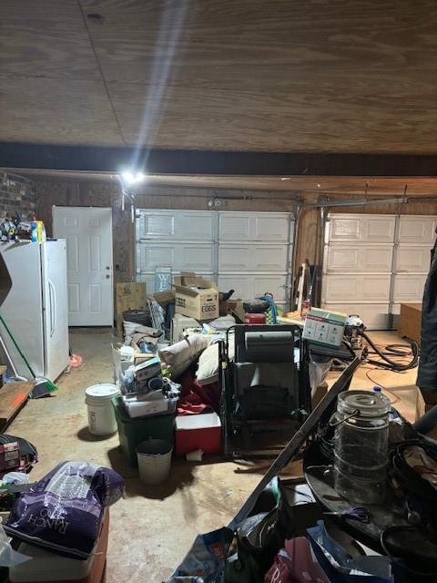 garage with freestanding refrigerator