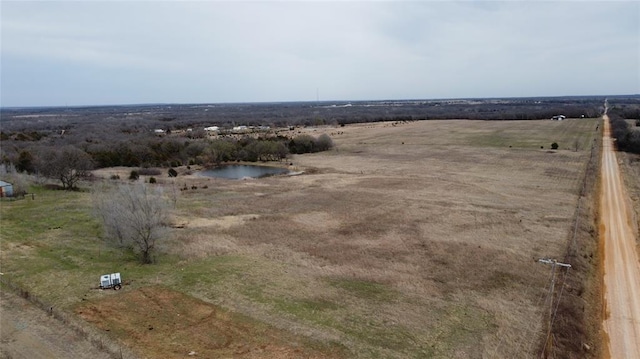 drone / aerial view featuring a rural view and a water view