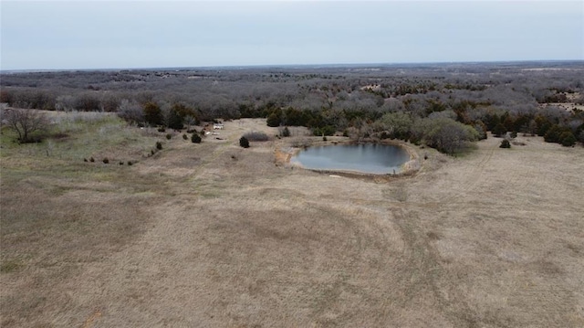 drone / aerial view with a water view and a rural view