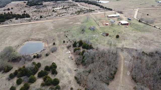 birds eye view of property with a rural view